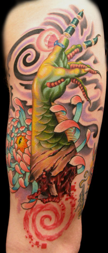Tattoos - severed dragon lady arm with flower - 22242